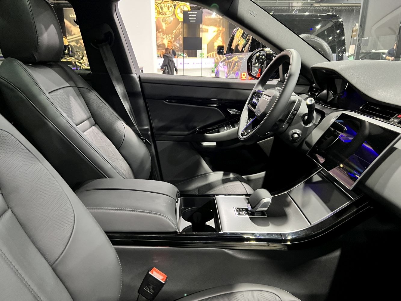 Luxury black leather seats and advanced dashboard with touchscreen and modern controls