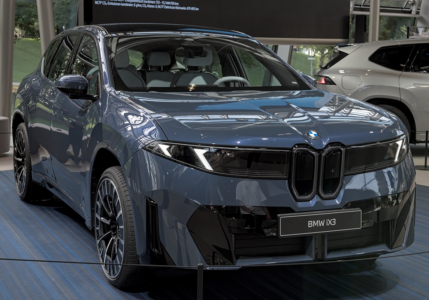 Front view with LED headlights of modern electric SUV