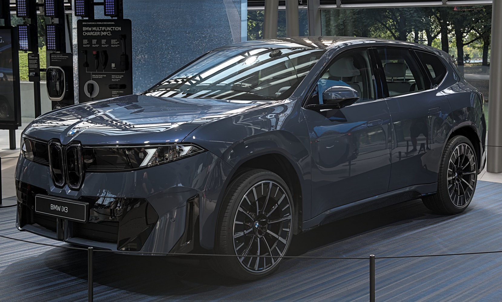 Electric SUV with kidney grille, sleek LED headlights, and multi-spoke alloy wheels