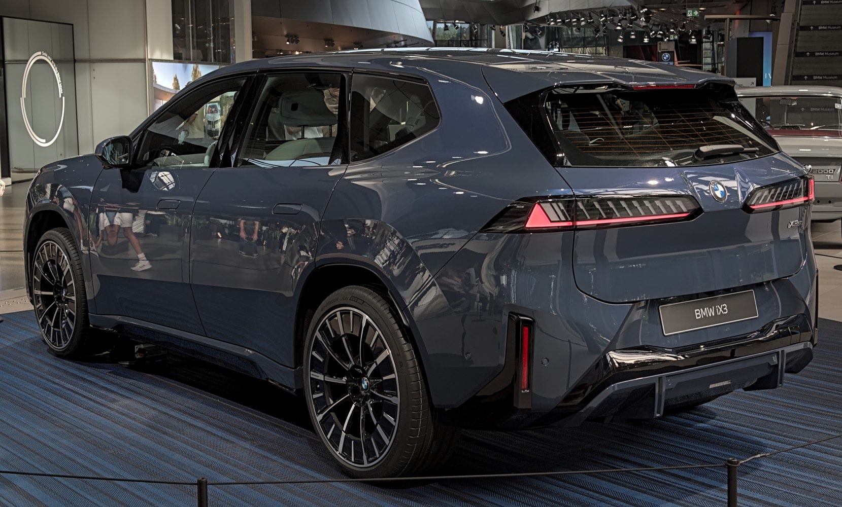Sleek electric SUV rear with LED taillights and large alloy wheels