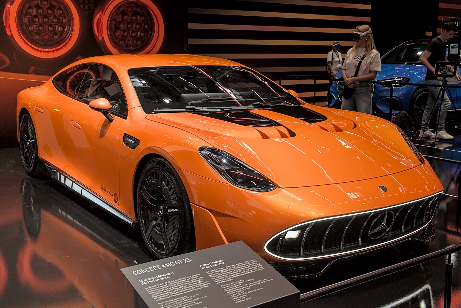 Orange sports coupe with black accents and aggressive grille