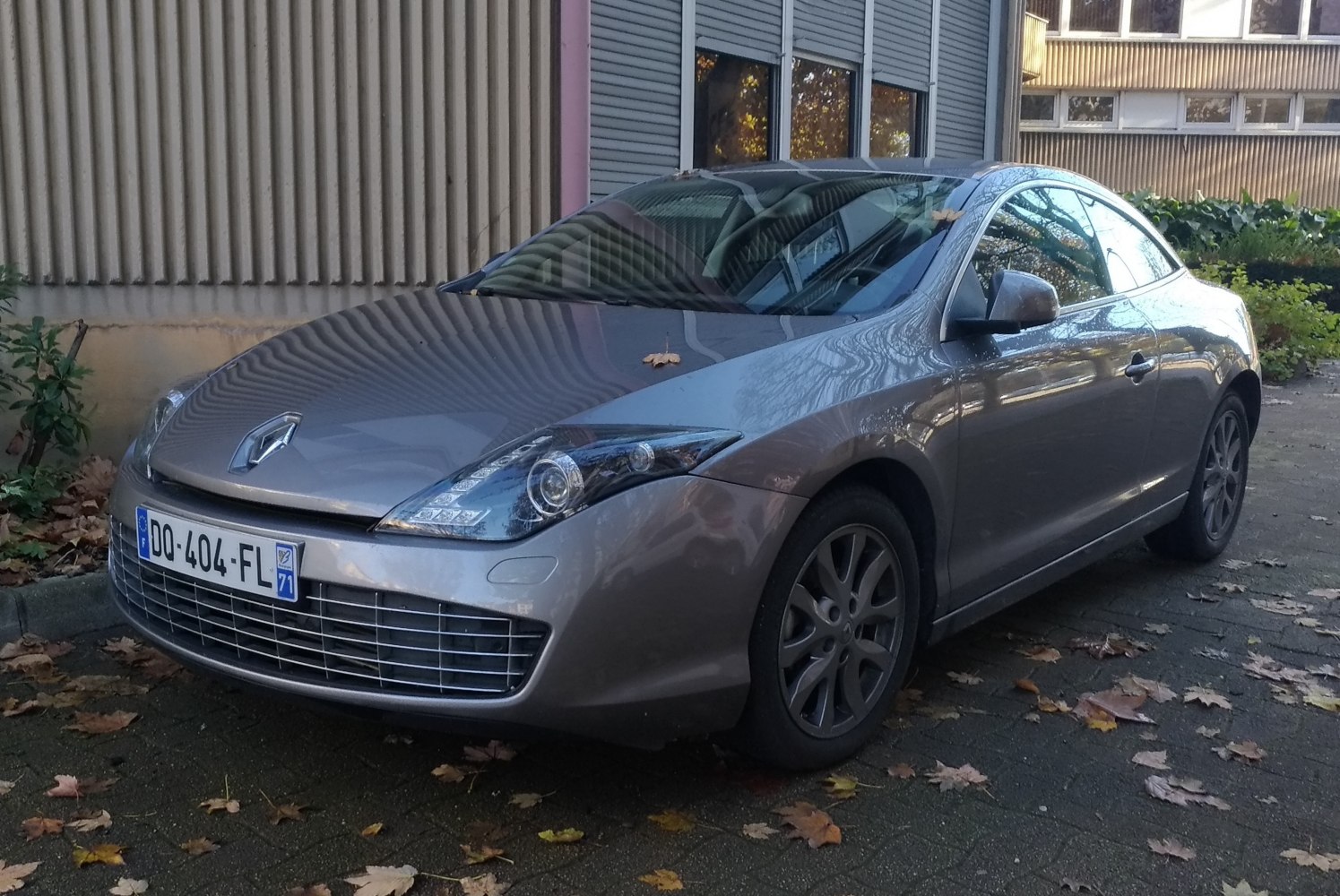 Front-side view of a sleek coupe with distinct headlights and grille.