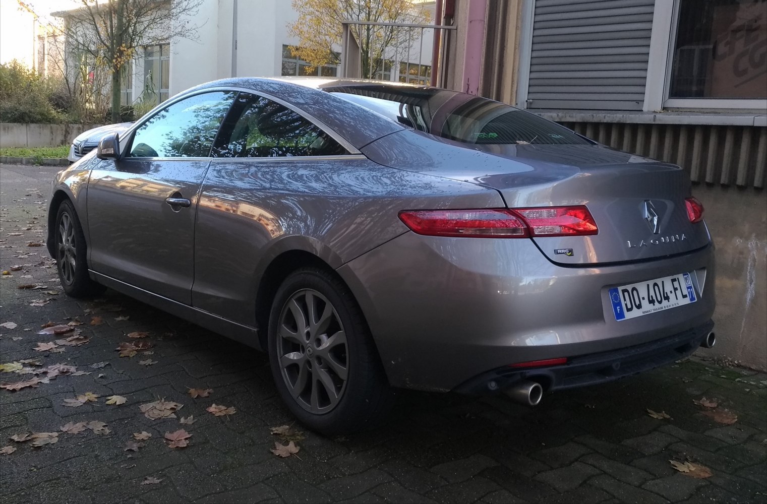 Rear view of a sleek coupe with dual exhausts and LED taillights
