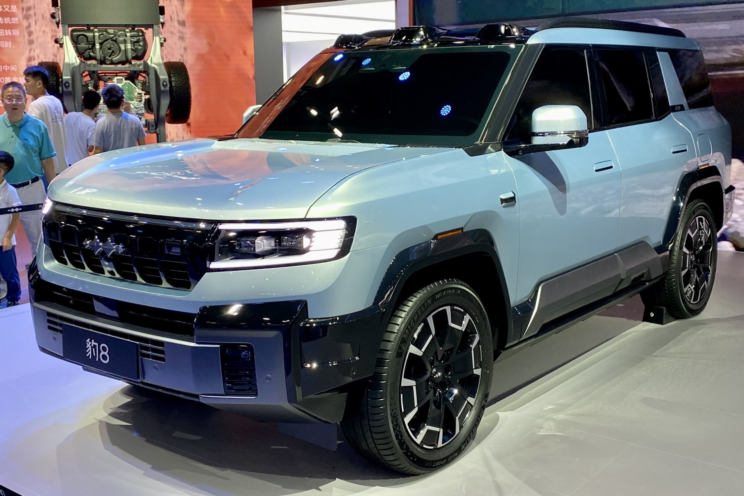 Front-side view of SUV with modern grille and LED headlights