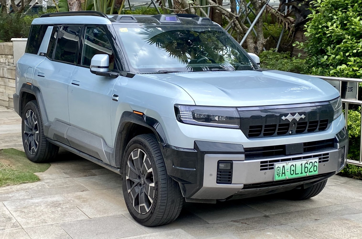 Front view of modern SUV with unique grille and integrated headlights