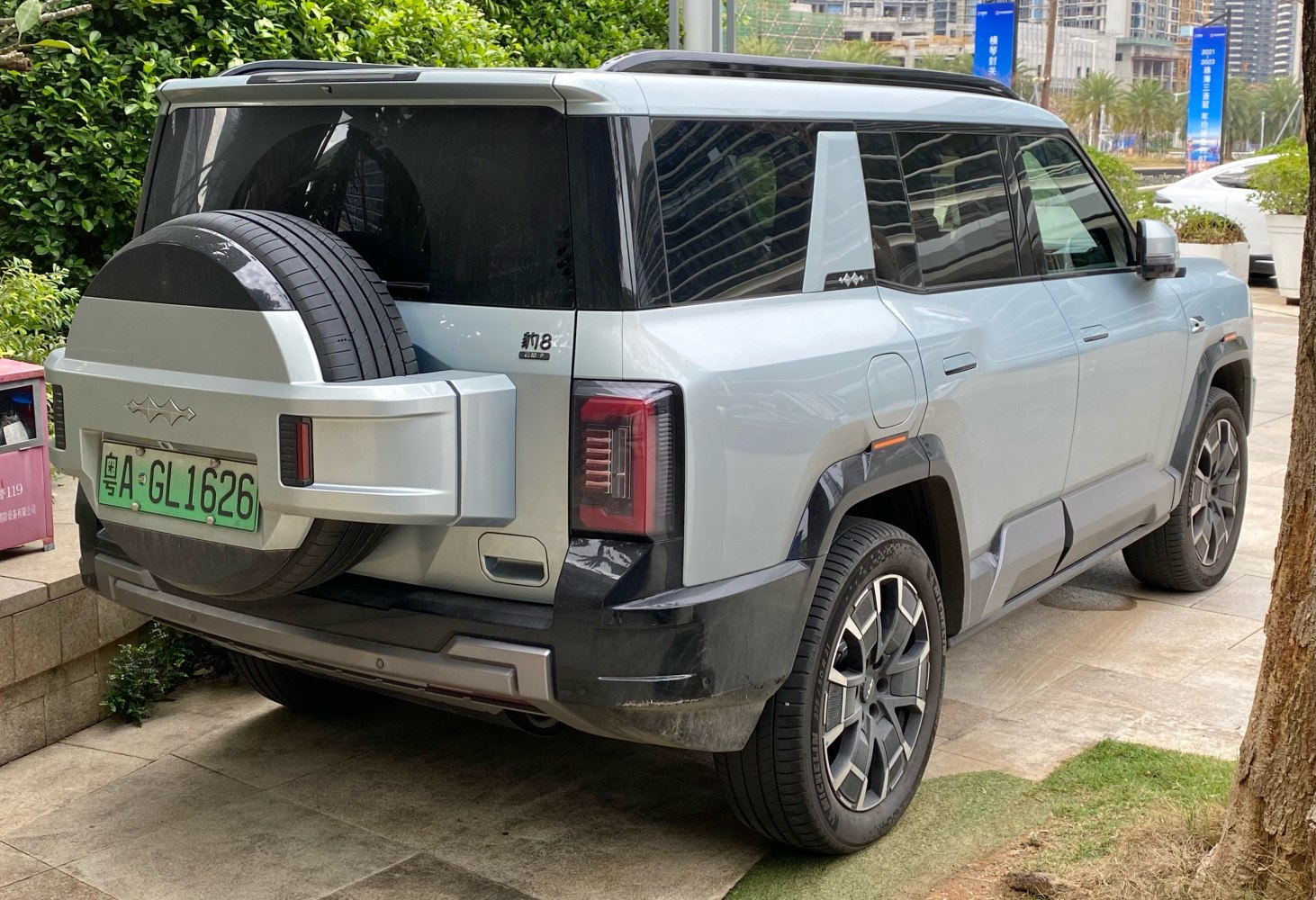 Modern SUV rear design with mounted spare tire and sleek taillights