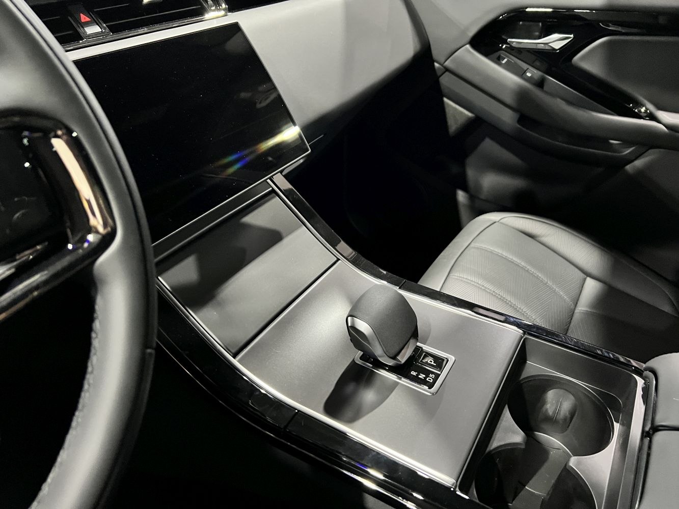 Modern gear selector and touchscreen in premium car interior