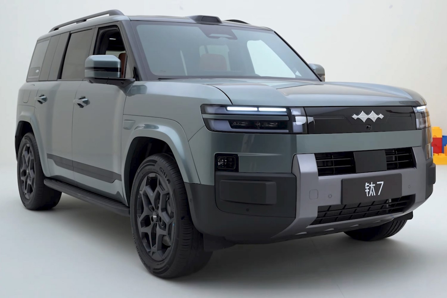 Modern SUV front three-quarter view with LED headlights and rugged design