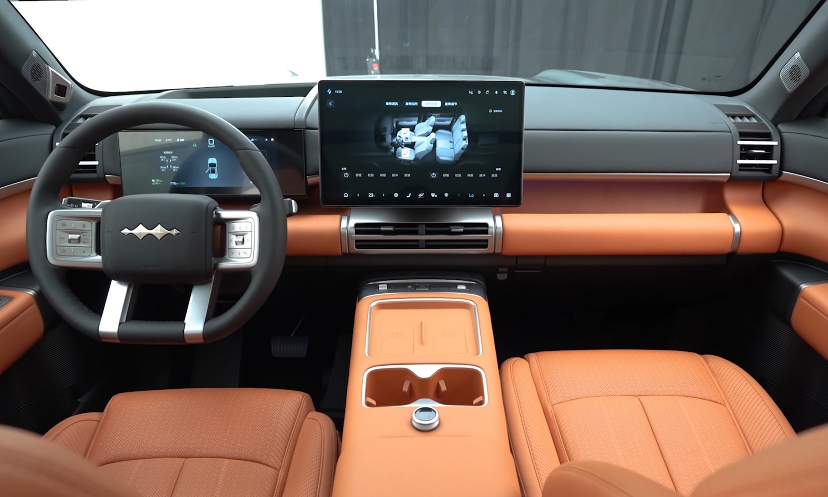 Digital dashboard and orange leather interior with large infotainment screen