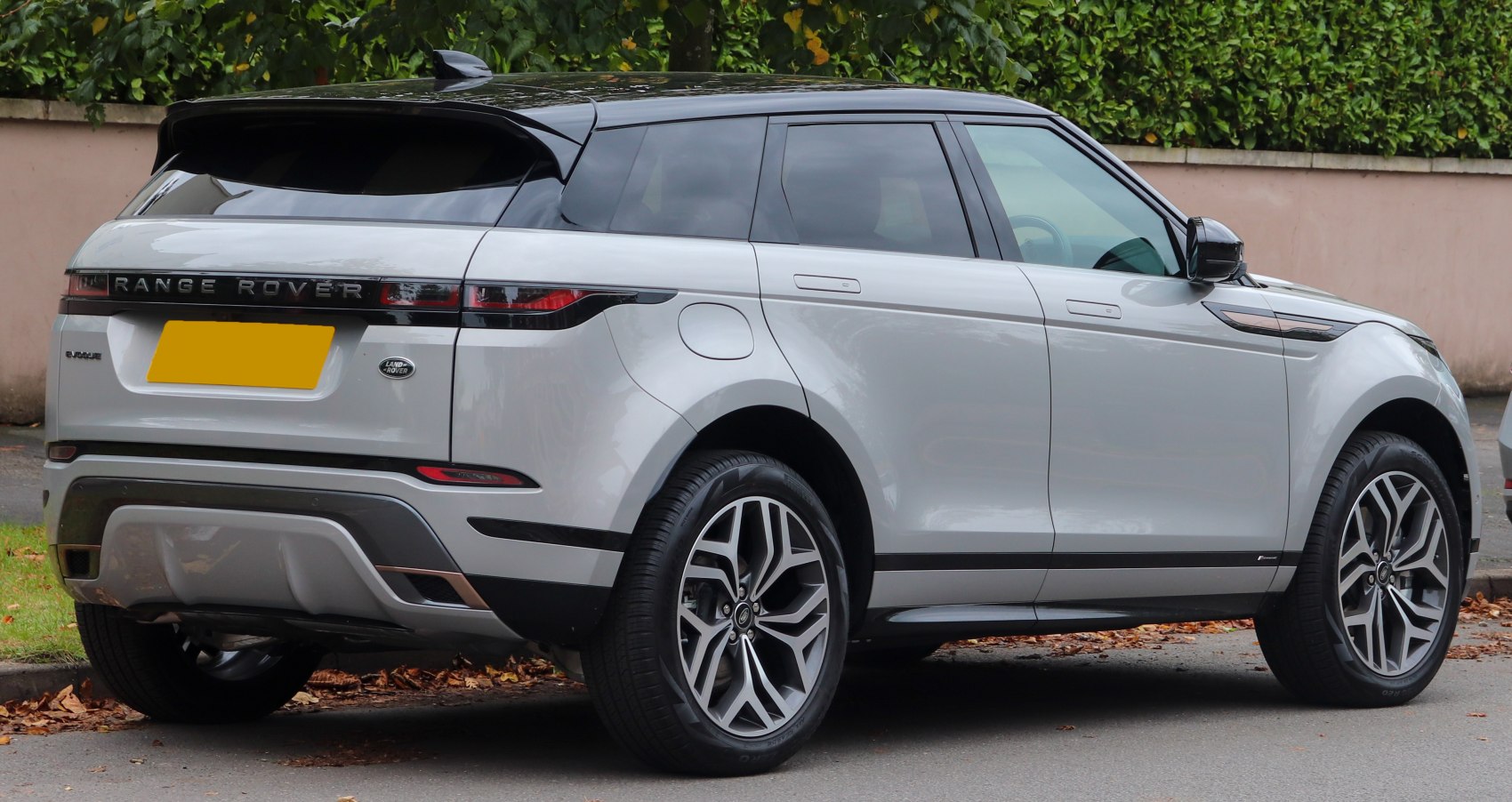 Rear view with sleek taillights and alloy wheels of modern SUV.