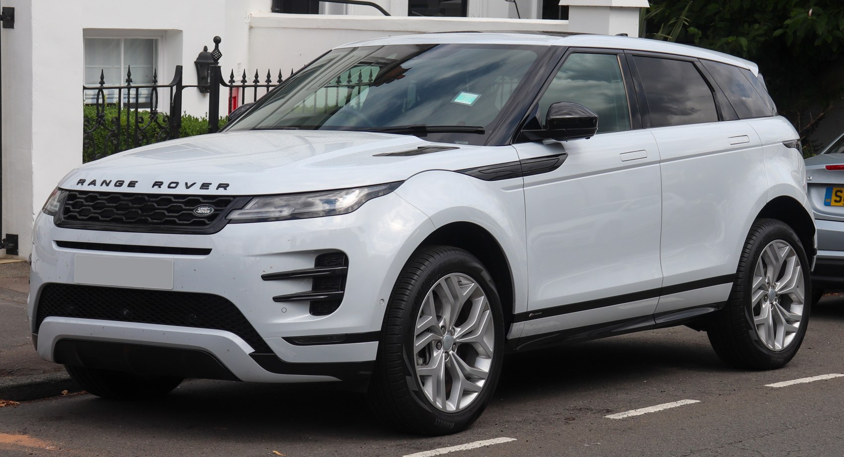 Front-side view of a compact SUV with sleek headlights and large alloy wheels