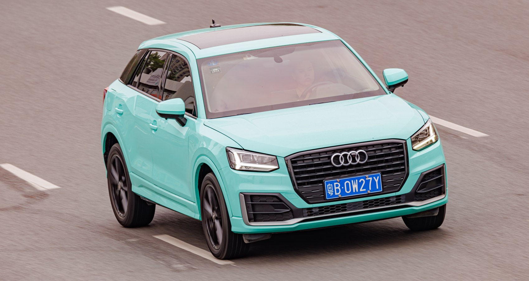 Front view of a compact SUV with distinctive LED headlights and grille