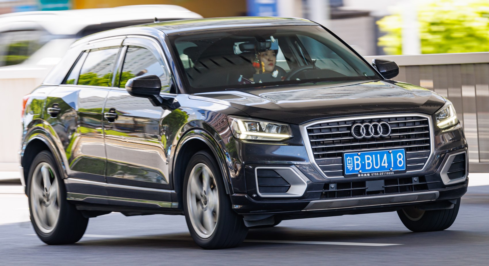 Front view of black SUV with LED headlights and bold grille