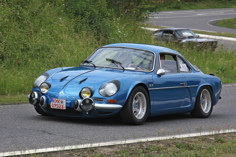 Front end of a classic blue coupe with multiple rally-style fog lights