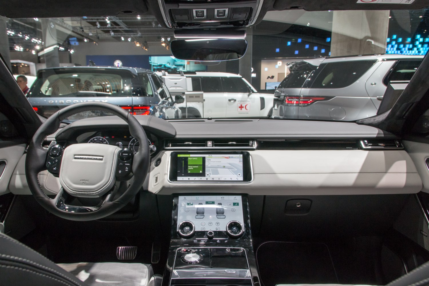 Luxury SUV interior with digital dashboard and dual touchscreen controls