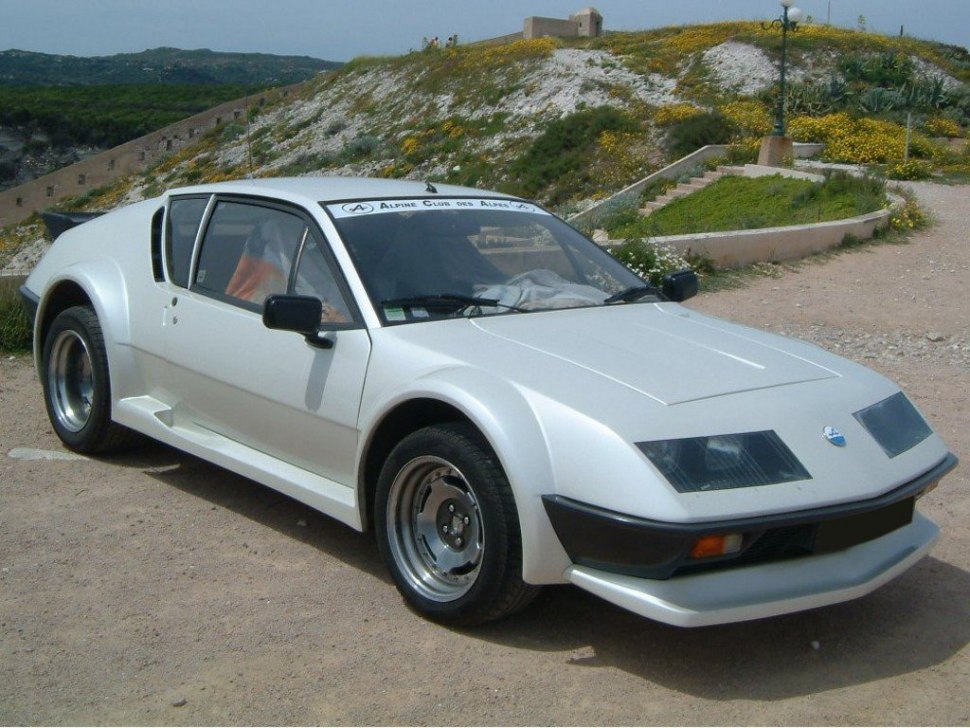 Wedge-shaped white sports coupe with pop-up headlights.