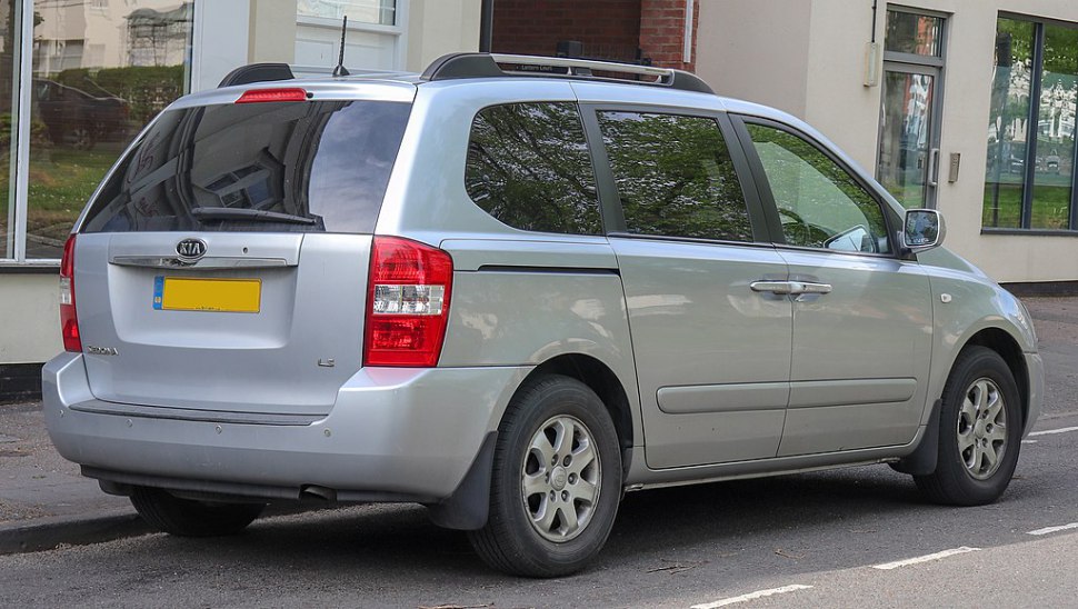 Minivan rear with taillights and side profile with roof rails