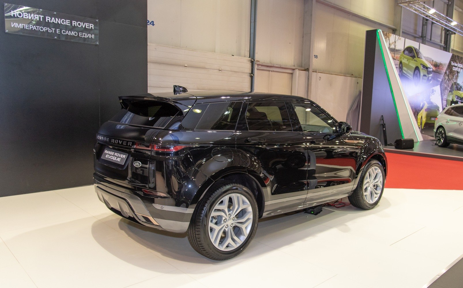 Luxury SUV rear and side profile with aerodynamic spoiler and alloy wheels