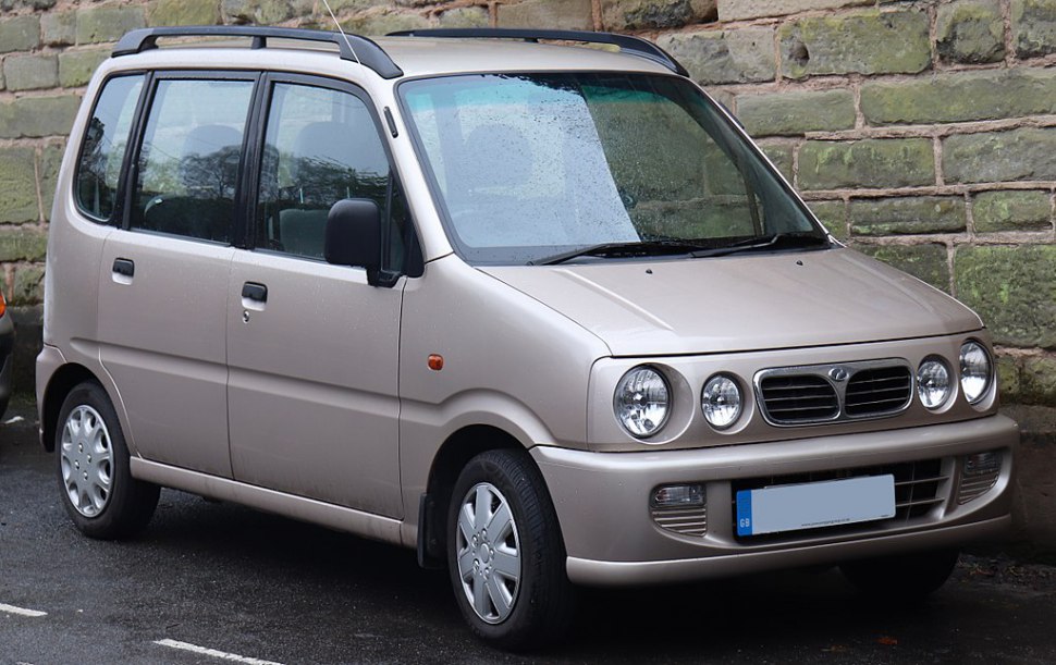 Compact MPV with distinctive round quad headlights and roof rails