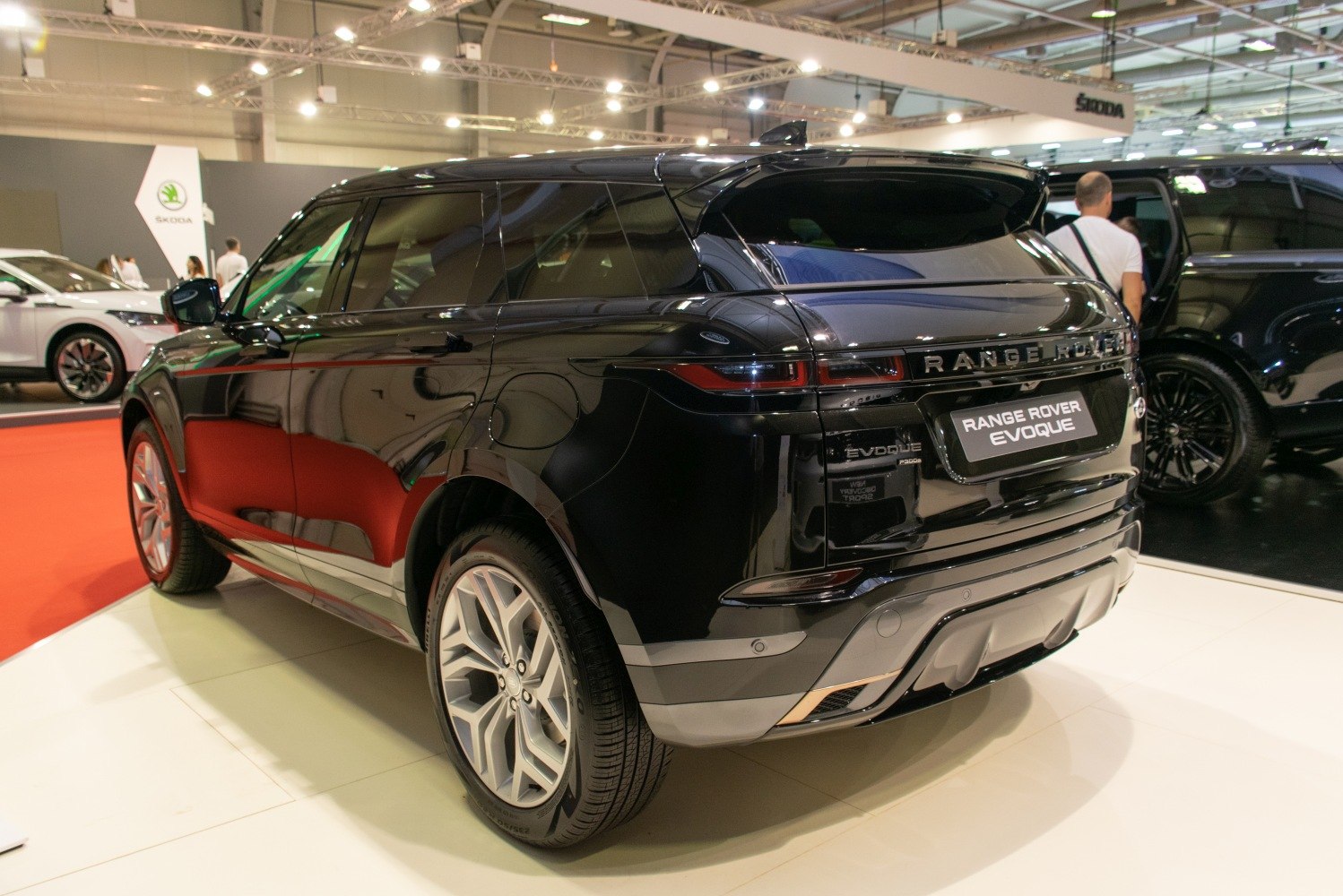 Rear view of a sleek black luxury SUV with LED taillights and modern rear design
