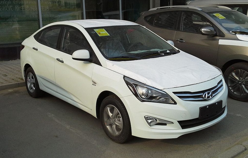 White 2015 sedan with updated grille and headlights
