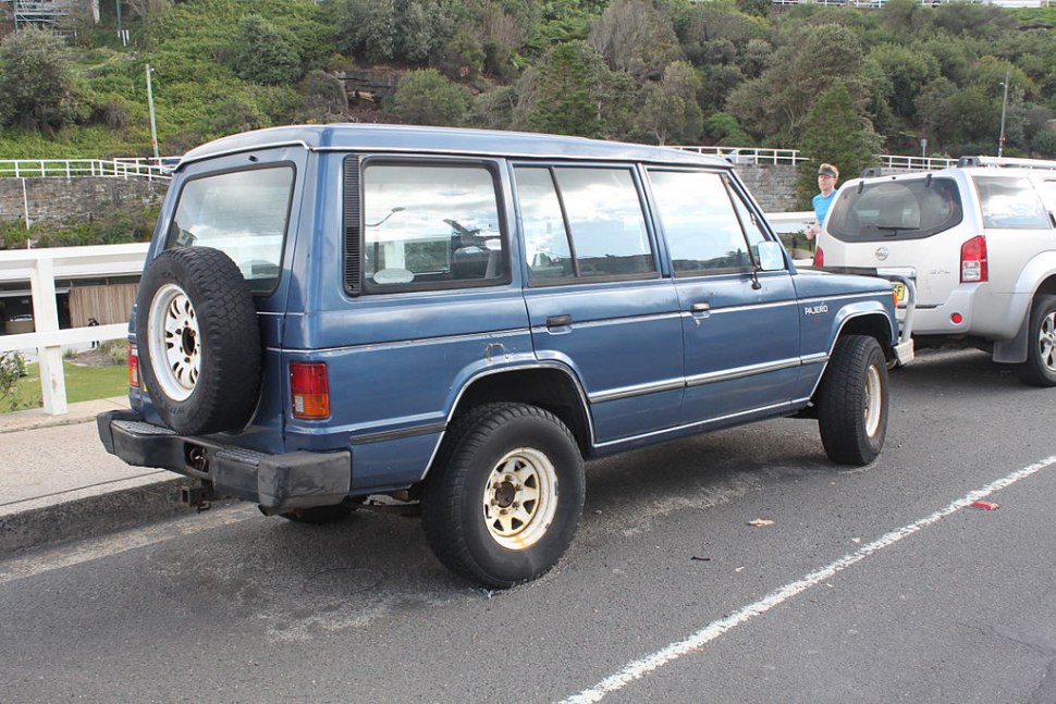 1989 rugged off-road SUV with rear-mounted spare tire and large side windows