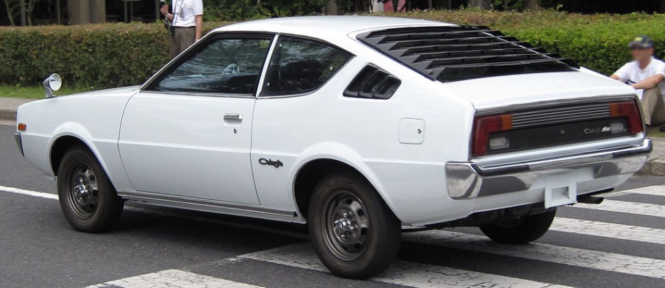 Classic coupe with rear window louvers and sleek side profile