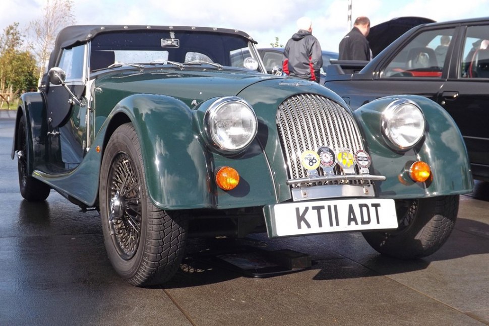Front view with rounded headlights and wire spoke wheels