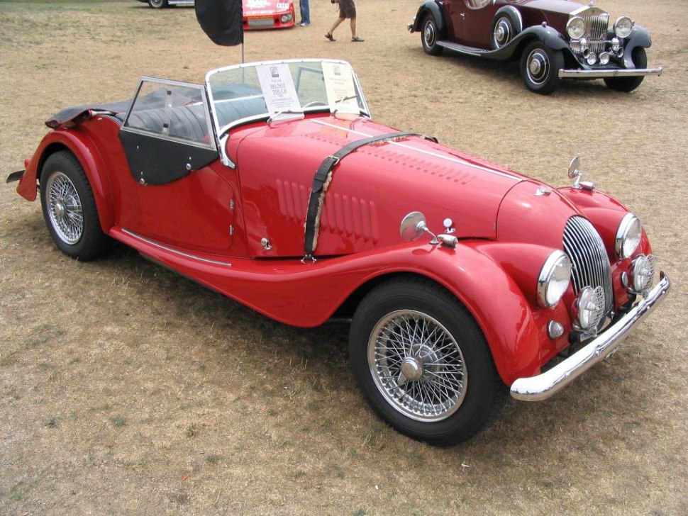 Open-top vintage sports vehicle with wire wheels and classic retro styling