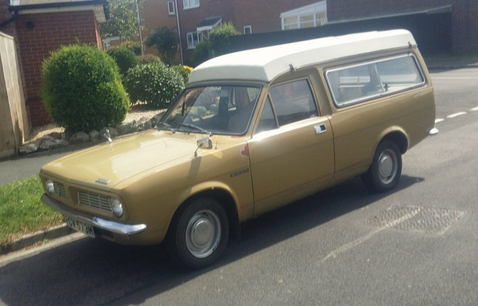 Station wagon with raised white roof canopy and side mirrors