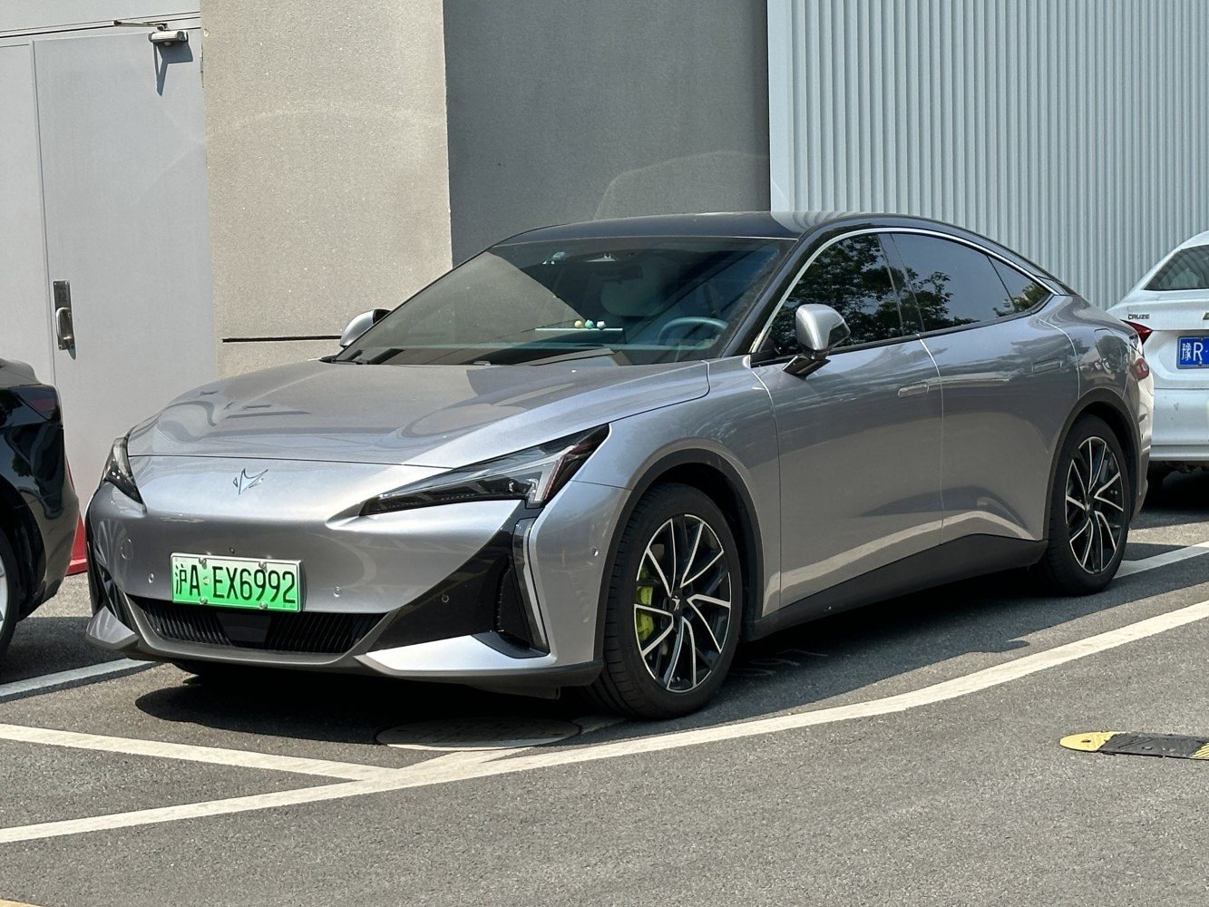 Electric sedan with aerodynamic design and distinctive LED headlights
