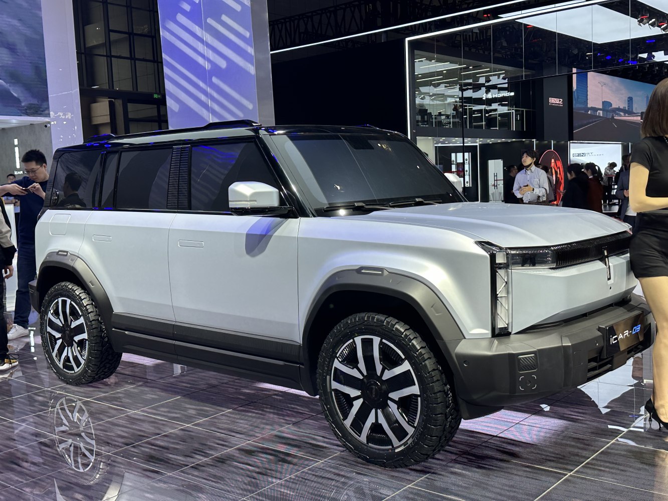 Angular LED headlights and rugged tires on a boxy SUV.