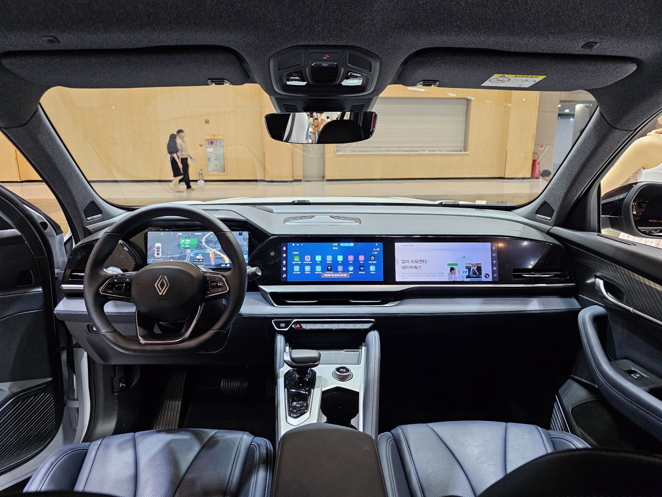 Digital dashboard with dual large touchscreens and premium leather interior