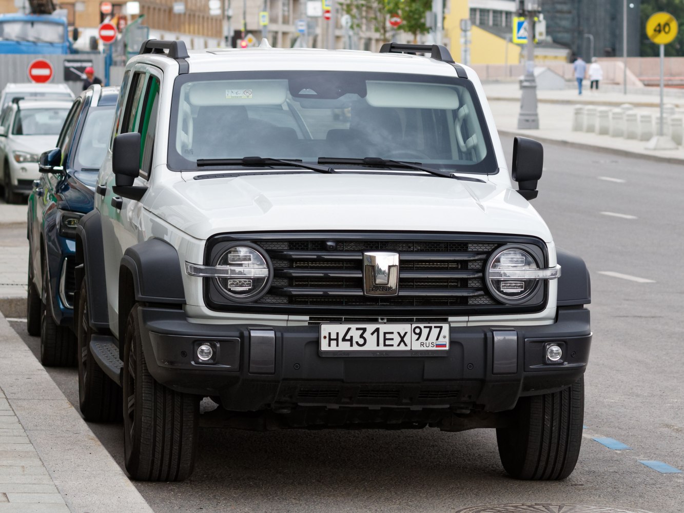 Front view of SUV with round headlights and rugged grille