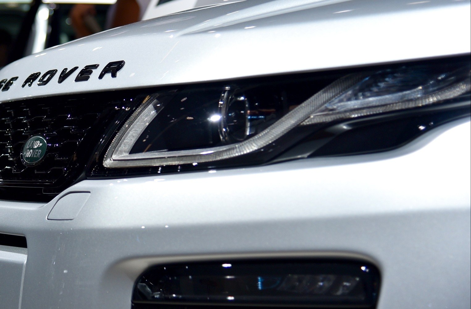 Front headlight and grille close-up with Land Rover emblem