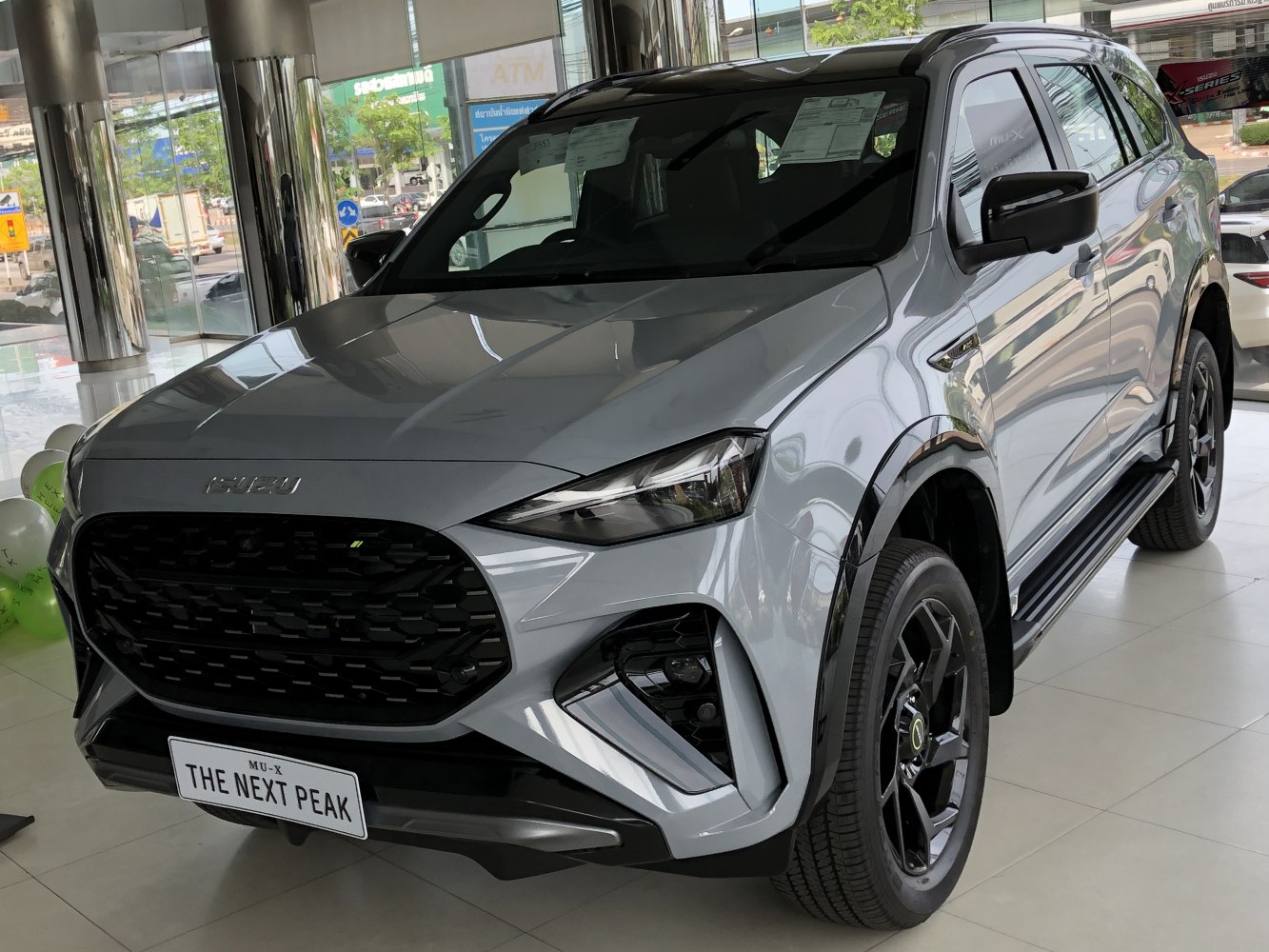 Aggressive front grille with sleek headlights and black alloy wheels