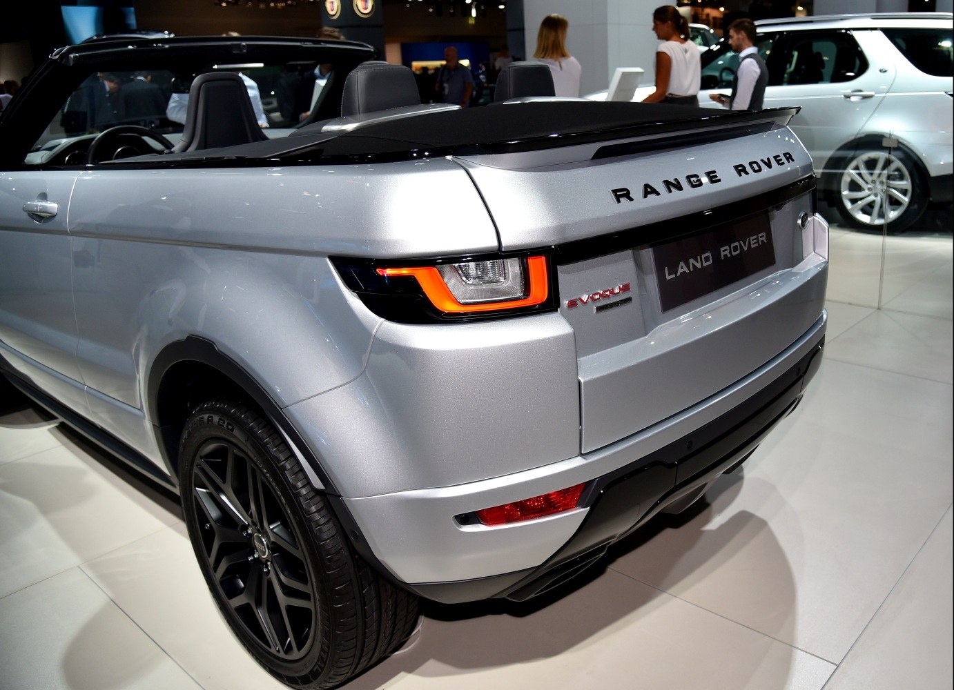 Rear view of a convertible SUV with LED tail lights and black rims