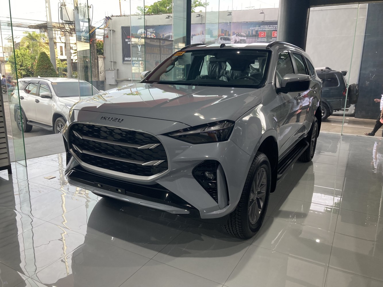 Prominent front grille and sharp headlights design of a modern SUV