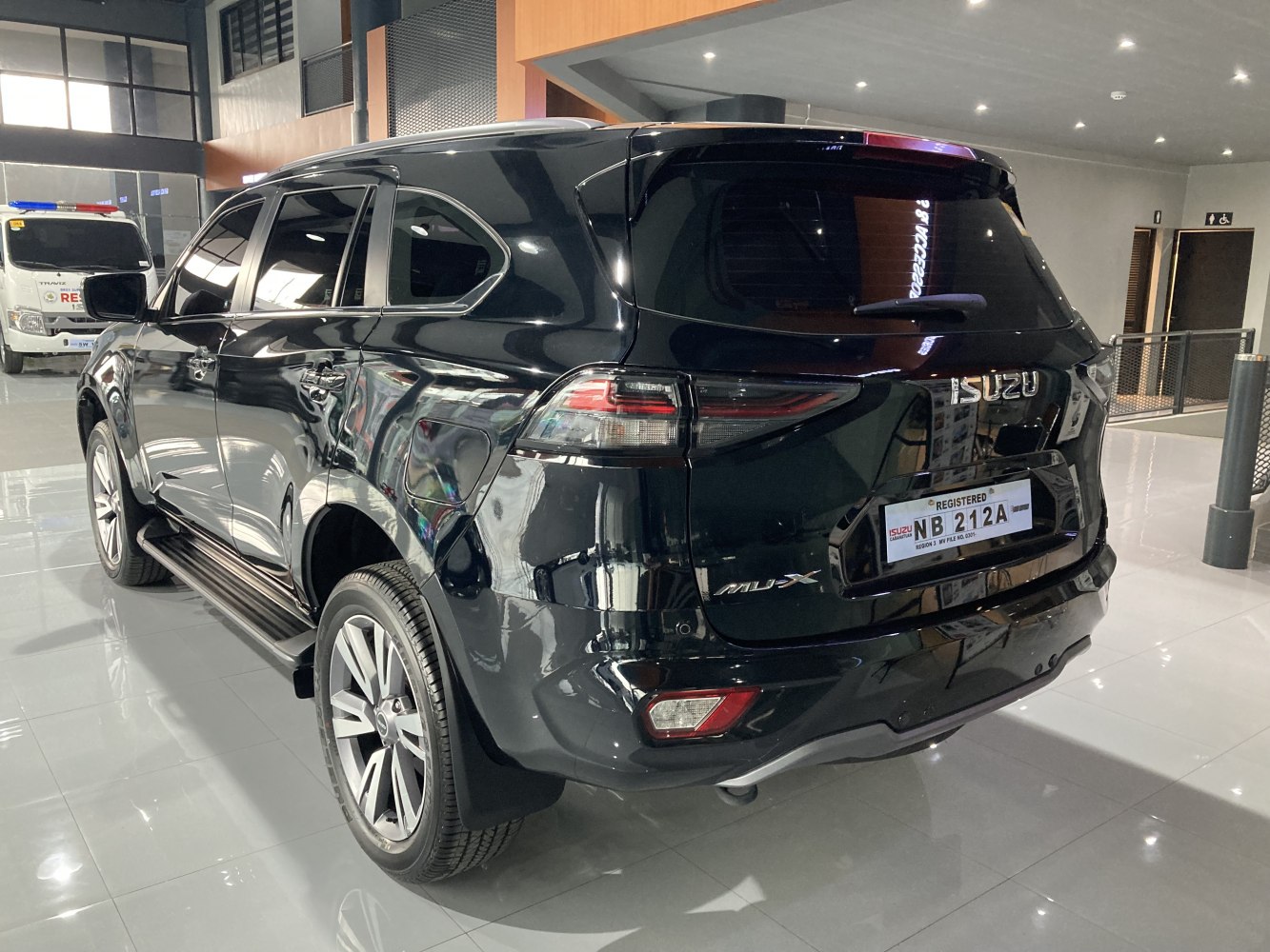 Rear exterior of black modern SUV with LED taillights and alloy wheels