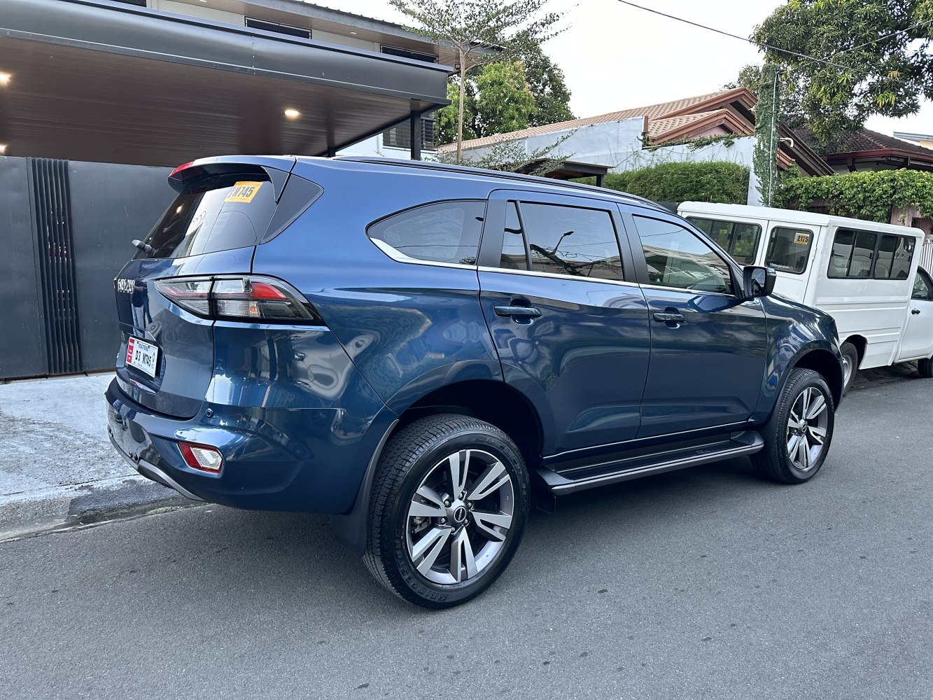 Sporty blue SUV with alloy wheels and tinted windows