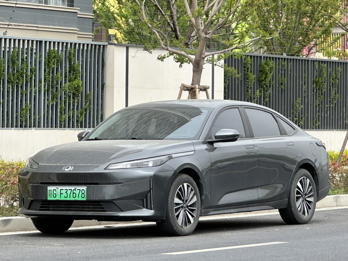 Electric sedan with sharp LED headlights and aerodynamic design