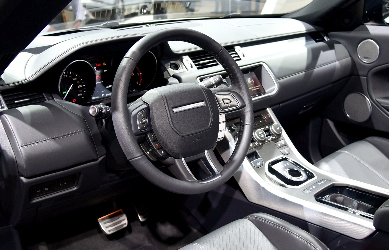 Steering wheel and dashboard interior with center console controls