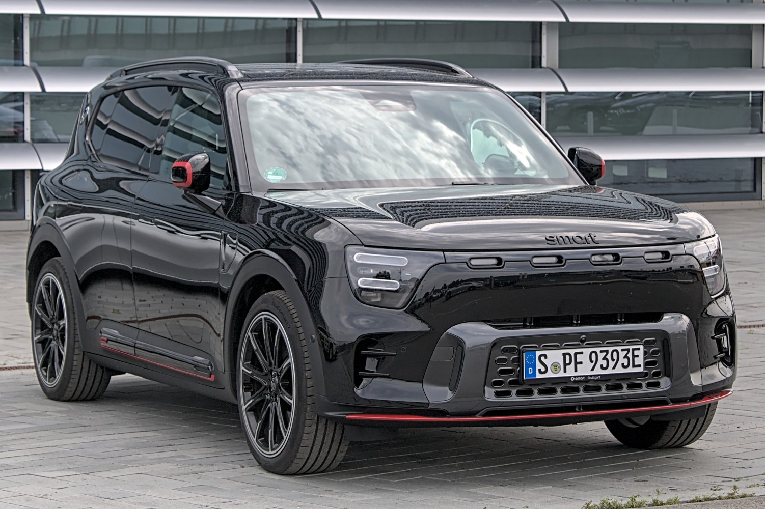 Electric SUV front and side view with modern lighting and aerodynamic shape
