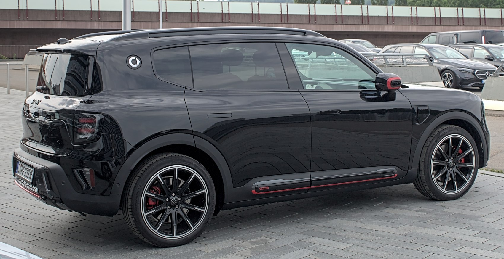 Black modern SUV with tinted windows and sporty alloy wheels