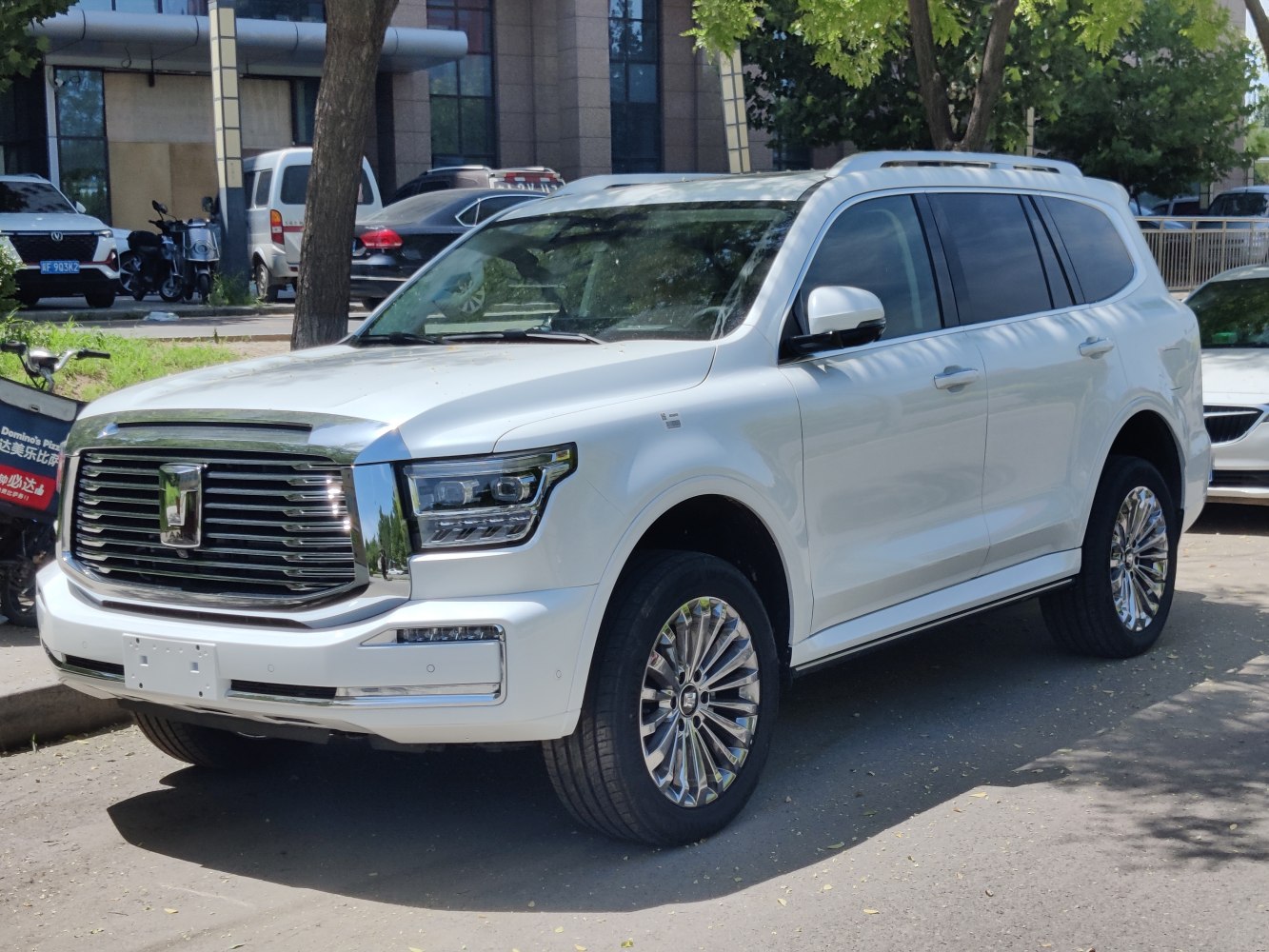 Large chrome grille and LED headlights on a luxury SUV