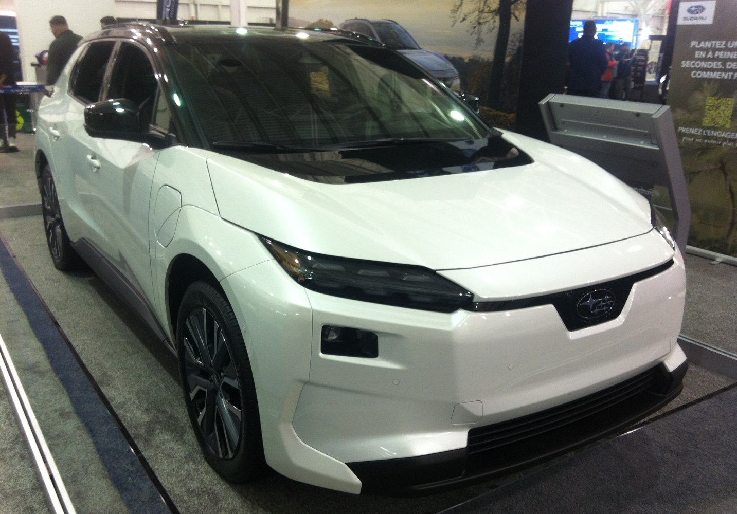 Electric SUV front angle with sleek LED headlights and aerodynamic body.