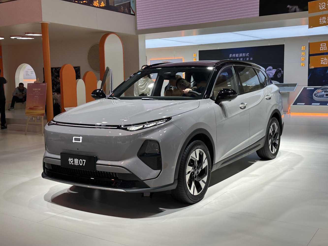 Modern electric SUV with two-tone black roof and slim LED headlights