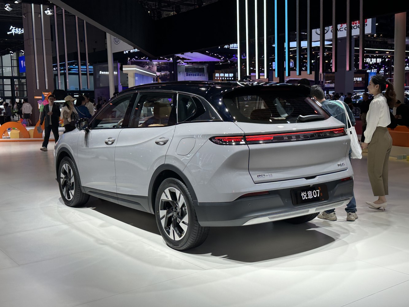 Sleek rear design with continuous LED lights and modern side profile of SUV