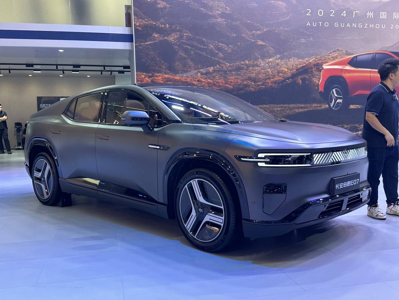Futuristic electric SUV with LED light bar and sleek body design
