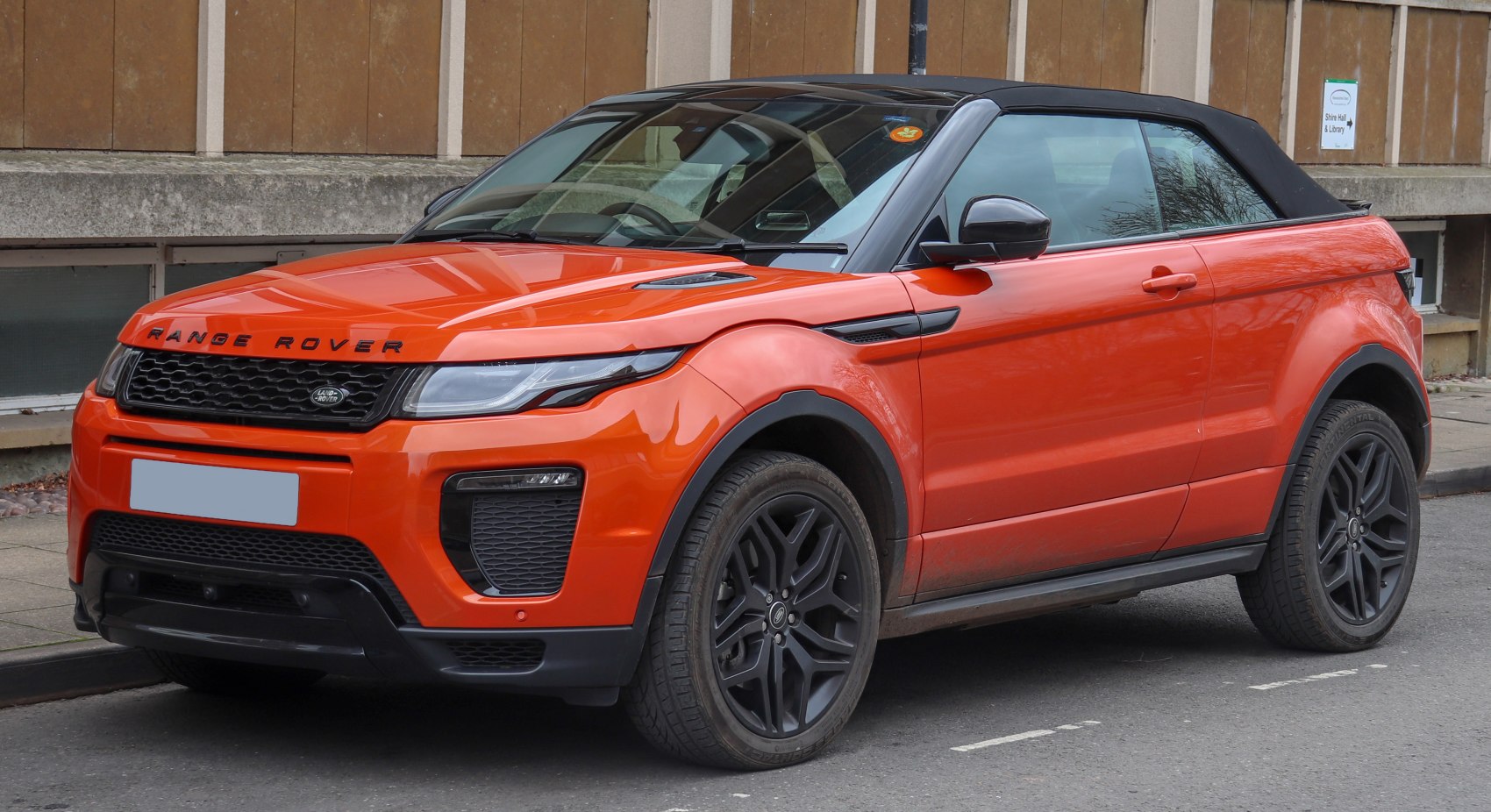 Orange convertible SUV with black wheels and modern facelift design